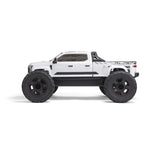 ARRMA 1/7 Big Rock 6S 4WD BLX RTR monster truck with large tires, bright orange body, and detailed rugged design.