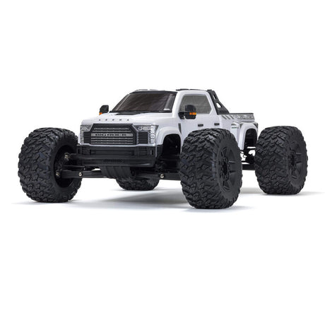 ARRMA 1/7 Big Rock 6S 4WD BLX RTR monster truck with rugged tires and vibrant paint, ready for off-road adventures.