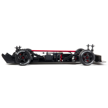 ARRMA 1/7 Infraction 6S AVC 4x4 RTR street basher RC car on a road surface, showcasing its sleek design and off-road tires.
