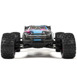 ARRMA 1/8 Kraton 6S BLX V6 4X4 RTR RC car on rugged terrain, showcasing its powerful design and off-road capabilities.