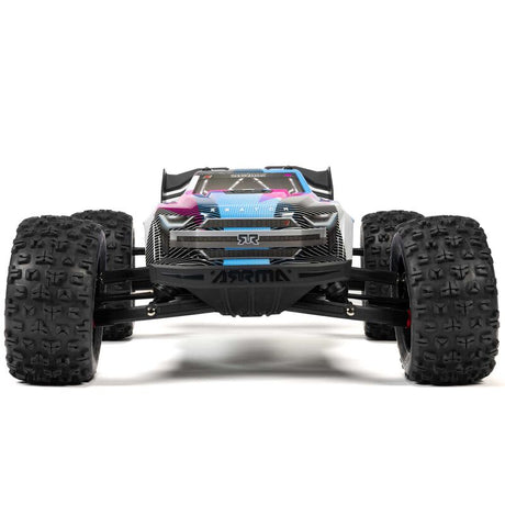 ARRMA 1/8 Kraton 6S BLX V6 4X4 RTR RC car on rugged terrain, showcasing its powerful design and off-road capabilities.