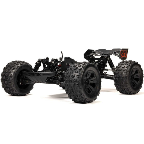 ARRMA 1/8 Kraton 6S BLX V6 4x4 remote control monster truck on rugged terrain, showcasing its powerful design and vibrant color.