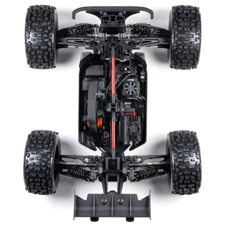 ARRMA 1/8 Notorious 4x4 6S BLX brushless V6 stunt truck RTR on rugged terrain, showcasing its powerful design and off-road capabilities.