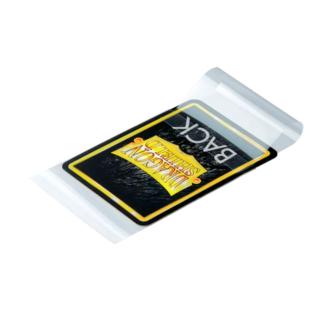 Clear Dragon Shield card sleeves with sealable perfect fit design for protecting trading cards, shown lying flat on a white surface.