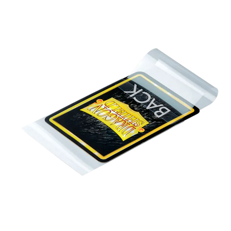 Clear Dragon Shield card sleeves with sealable perfect fit design for protecting trading cards, shown lying flat on a white surface.