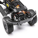 Axial 1/24 SCX24 Lexus GX 470 4x4 RTR brushed rock crawler on rough terrain, showcasing detailed exterior and rugged tires.