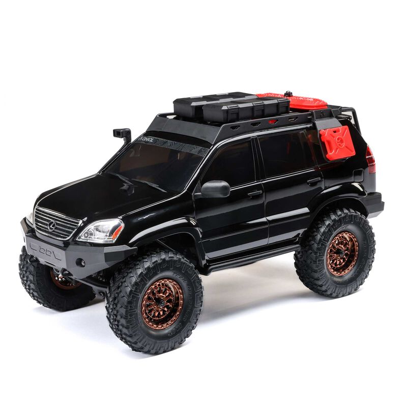 Axial 1/24 SCX24 Lexus GX 470 4x4 RTR brushed rock crawler on rough terrain with detailed exterior and rugged tires