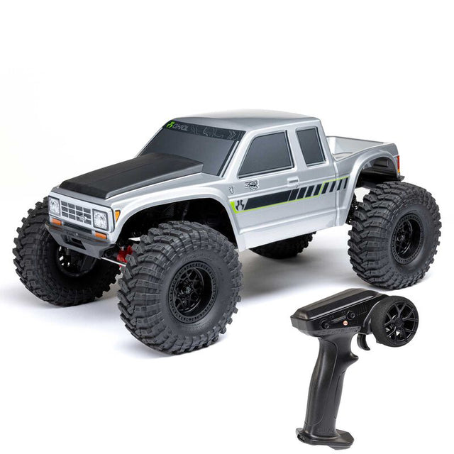 Axial 1/10 SCX10 III Coyote 4x4 RTR brushed rock crawler with detailed chassis, tires, and RC body in rugged off-road setting