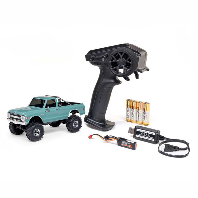 Axial 1/30 scale SCX30 Chevrolet K10 4x4 brushed rock crawler with detailed body and off-road tires, ready for outdoor terrain.
