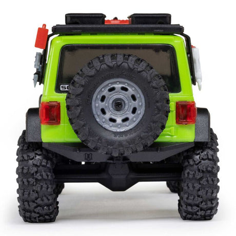 Axial 1/30 scale SCX30 Jeep Wrangler JLU 4x4 brushed rock crawler on rugged terrain