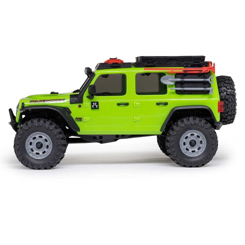 Axial 1/30 scale SCX30 Jeep Wrangler JLU 4x4 brushed rock crawler model with detailed exterior and rugged tires.