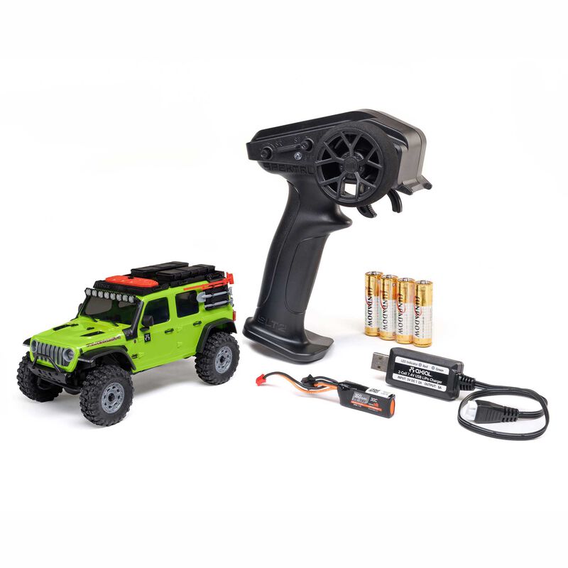 Axial 1/30 scale SCX30 Jeep Wrangler JLU 4x4 RTR brushed rock crawler on rugged terrain