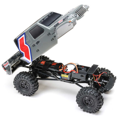 Axial SCX24 Summit Racing Jeep Gladiator 4x4 rock crawler RTR with detailed exterior and rugged tires.