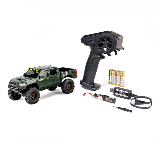 Axial SCX30 Toyota Tacoma TRD Pro 1/30 scale remote control rock crawler on rough terrain
