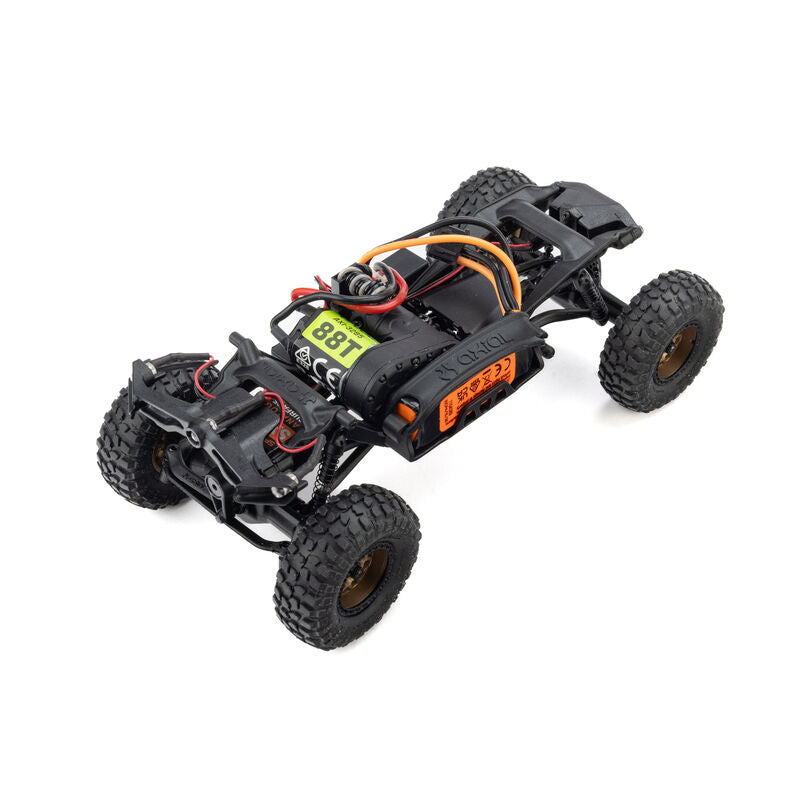 Axial SCX30 Toyota Tacoma TRD Pro 1/30 scale RC rock crawler on rugged terrain with detailed body and large off-road tires.
