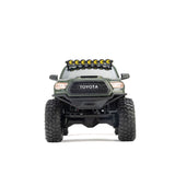 Axial SCX30 Toyota Tacoma TRD Pro 1/30 scale remote control rock crawler on rugged terrain