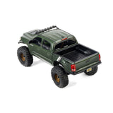Axial SCX30 Toyota Tacoma TRD Pro 1/30 scale remote control rock crawler on rough terrain.