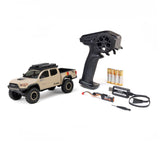 Axial SCX30 Toyota Tacoma TRD Pro 1/30 scale RC rock crawler on rugged terrain with detailed truck body and off-road tires.