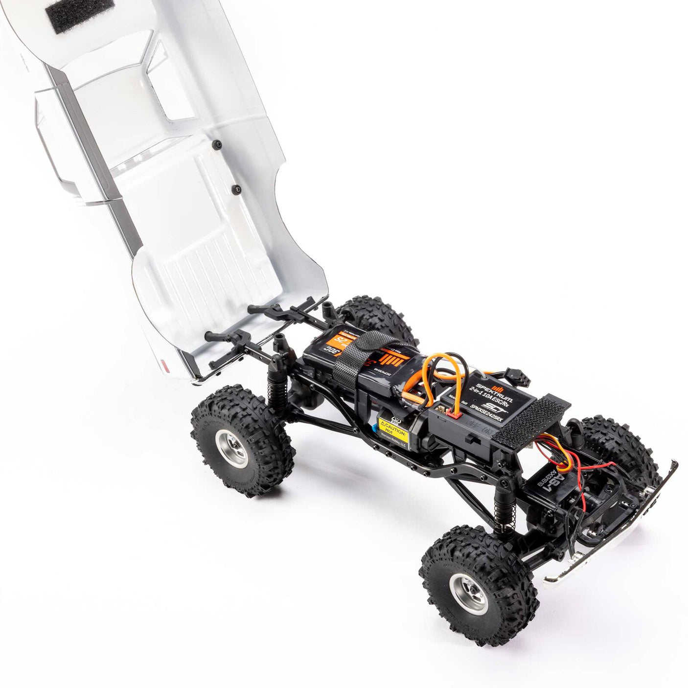 Axial 1/24 scale RC Chevrolet C10 4WD truck model from 1967-1972 with detailed body and rugged wheels, ready to run.