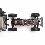 Axial 1/24 scale Jeep Wrangler JLU CRC 4x4 brushed rock crawler on rugged terrain, showcasing detailed off-road vehicle design.