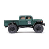 Axial 1/24 SCX24 Dodge Power Wagon 4x4 RTR brushed rock crawler on rugged terrain with detailed exterior and off-road tires.