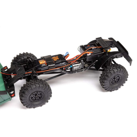 Axial 1/24 SCX24 Dodge Power Wagon 4X4 RTR brushed rock crawler on rough terrain