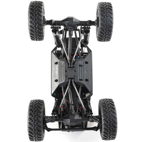 Axial 1/18 scale Capra 4WD RTR trail buggy in black and green with detailed rugged design and off-road tires.