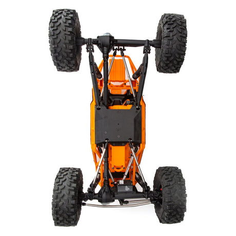Axial 1/10 RBX10 Ryft 4X4 RTR brushless rock bouncer crawling over rocky terrain.