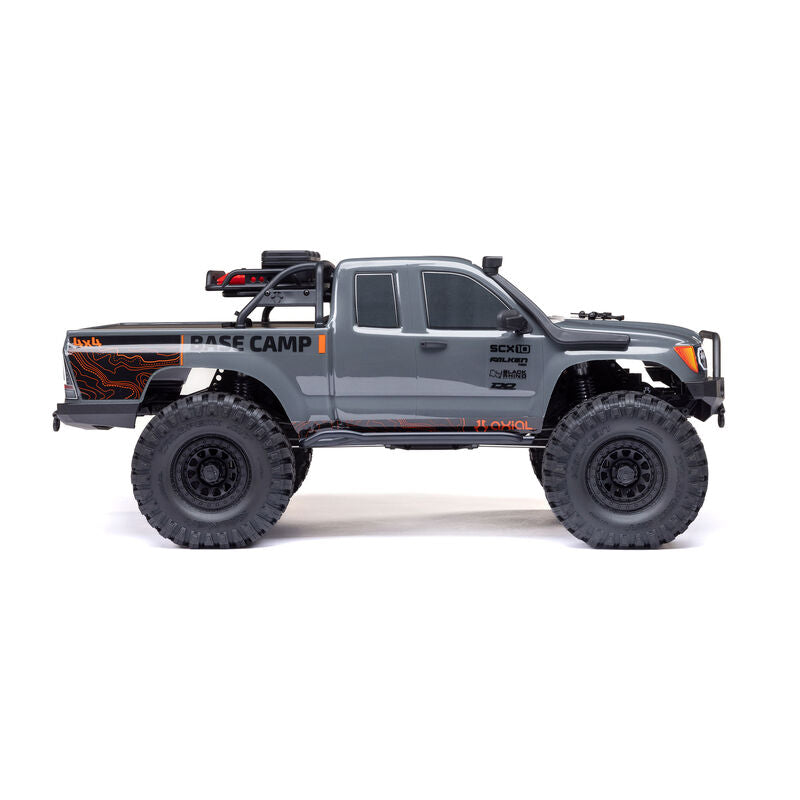 Axial 1/10 SCX10 III Base Camp 4x4 RTR brushed rock crawler in gray, showing the rugged off-road vehicle with detailed exterior.