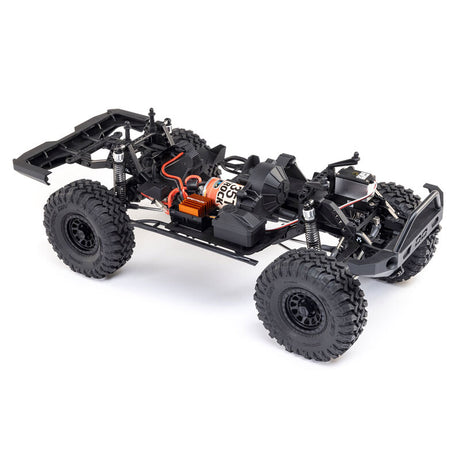Axial 1/10 SCX10 III Base Camp 4x4 RTR brushed rock crawler in gray with detailed chassis and rugged tires.