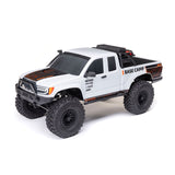 Axial 1/10 SCX10 III Base Camp 4x4 RTR brushed rock crawler in white with off-road tires and detailed chassis.