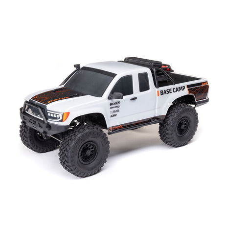 Axial 1/10 SCX10 III Base Camp 4x4 RTR brushed rock crawler in white with off-road tires and detailed chassis.