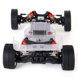 LC Racing BHC-1 1/14 scale 2WD buggy kit showing detailed chassis, suspension components, and racing tires.