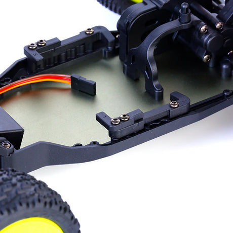 LC Racing BHC-1ST 1/14 scale 2WD stadium truck kit with chassis, wheels, and suspension components ready for assembly.