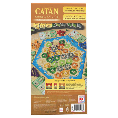 Catan Cities & Knights 5-6 Player Expansion 6th Edition by Catan Studio showing game box and components on a table.
