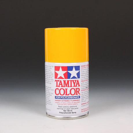 Tamiya PS-19 Camel Yellow spray paint can, 100ml, with yellow paint visible in the spray nozzle and can for modeling projects.
