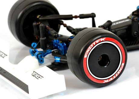 Exotek Racing F1 1/10 RC car front rubber tires V2 38X in red-medium, showing the textured rubber surface and tire tread pattern.