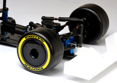 Pair of Exotek Racing F1 1/10 front disk wheels for RC car tires, showing detailed black plastic wheels with silver disc design.
