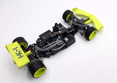 Red Reflex Racing FX28 Formula RC car kit with detailed body and racing decals on a smooth track surface.