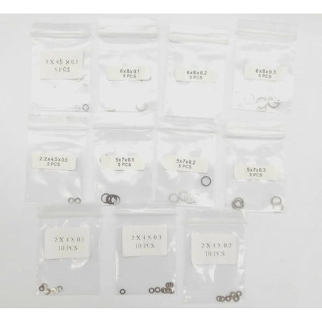 GL Racing Giulia shim set GG-S-031, close-up of metal shims with precise edges, used for automotive adjustments and tuning.