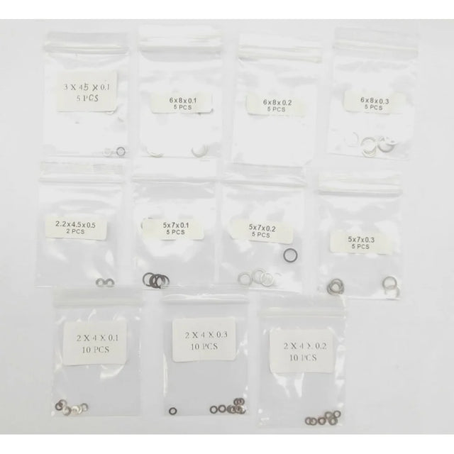 GL Racing Giulia shim set GG-S-031, close-up of metal shims with precise edges, used for automotive adjustments and tuning.