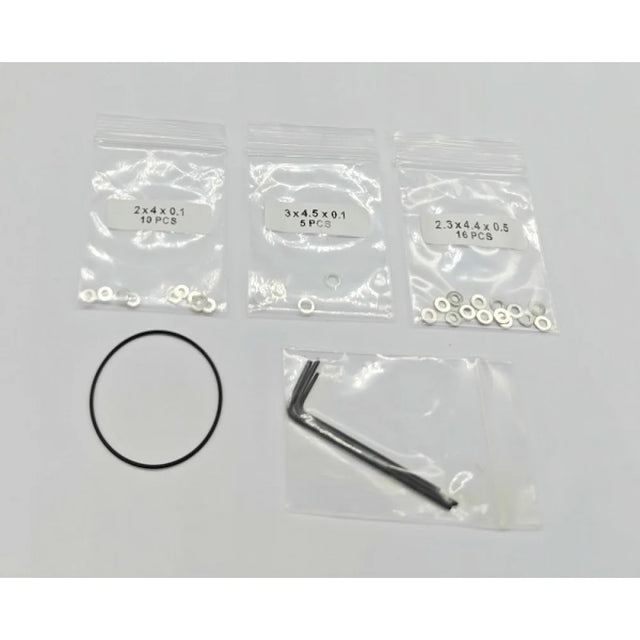 GL Racing LMP2 Shim Set showing precision-engineered metal shims for race car suspension adjustments.