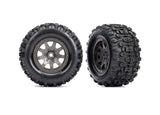 Gray Traxxas Mini Maxx/XRT 4-inch front wheels for RC trucks, showing detailed tread and wheel design.