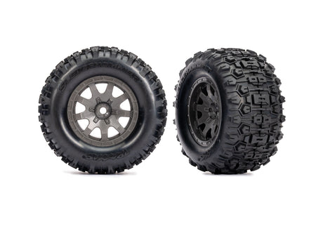 Gray Traxxas Mini Maxx/XRT 4-inch front wheels for RC trucks, showing detailed tread and wheel design.