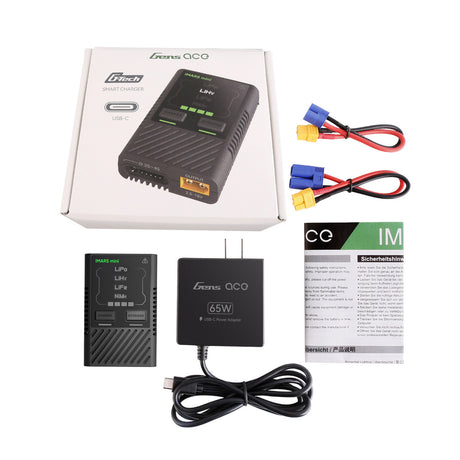Gens Ace iMARS Mini G-Tech 60W RC car battery charger plugged into power, showing digital display and charging ports.