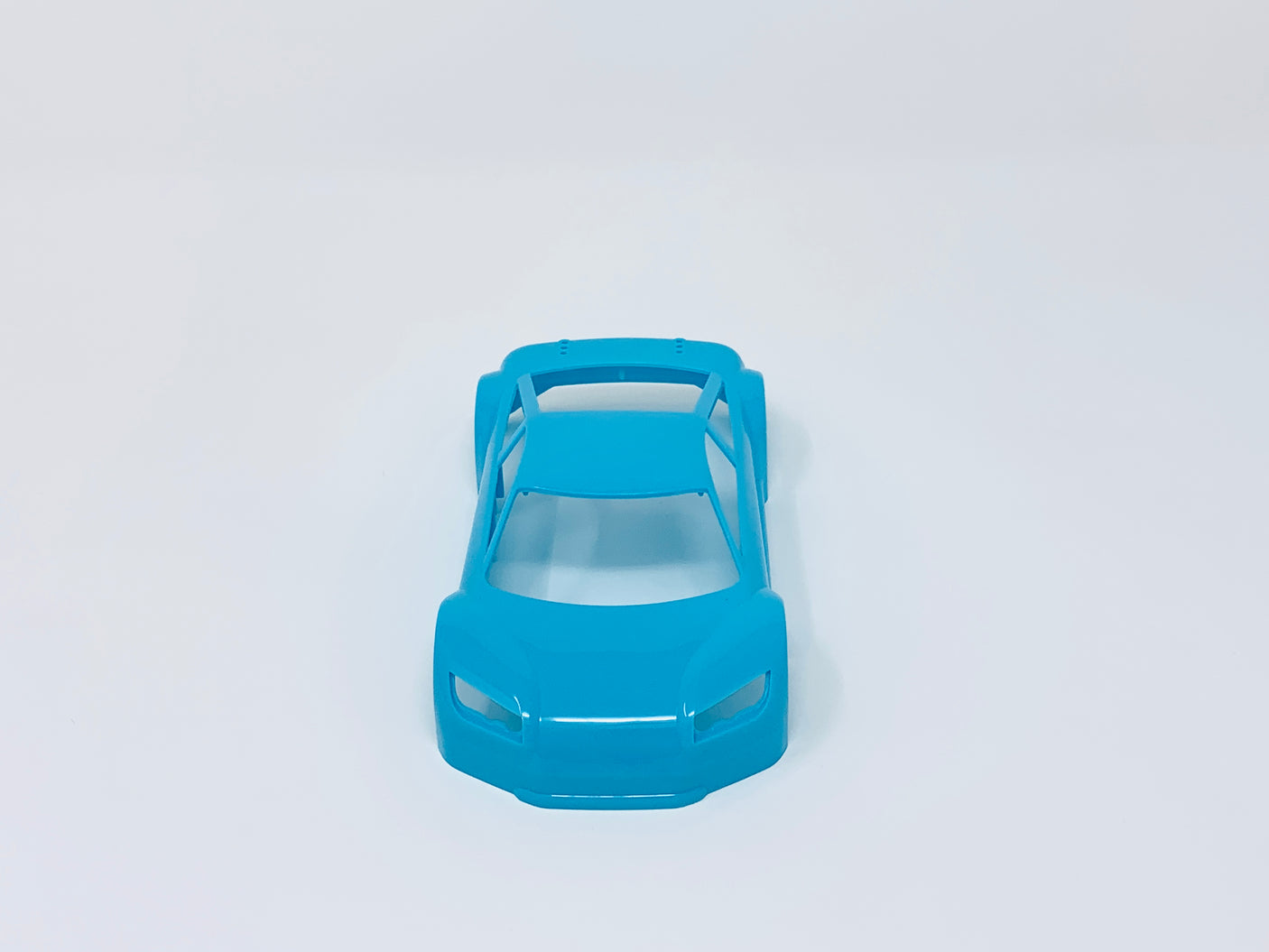 Jomurema GT01 car body set in vibrant neon blue, featuring detailed design and sleek finish for custom vehicle modification