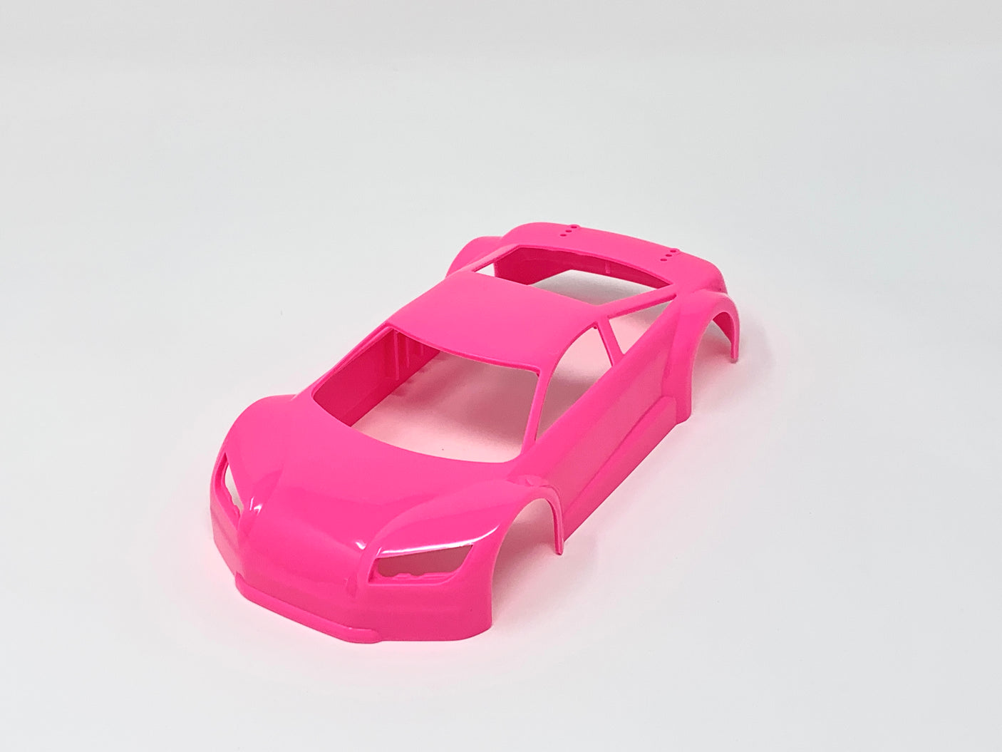 Jomurema GT01 car body set in neon pink, featuring detailed aerodynamic design for model cars.