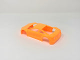 Jomurema GT01 car body in vibrant neon orange, designed for custom automotive builds, shown in a sleek side view.