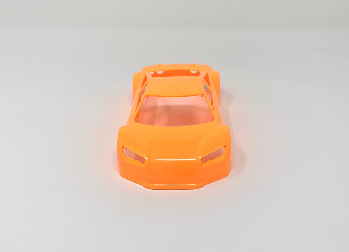 Jomurema GT01 car body in vibrant neon orange, showcasing sleek design and glossy finish for enhanced vehicle style.