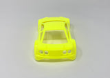 Jomurema GT01 car body in vibrant neon yellow, shown on a sleek vehicle with detailed close-up of the paint and design.